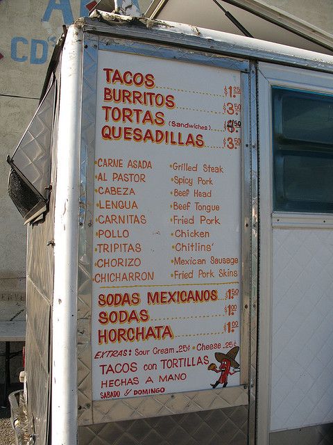 a food truck has a menu on it