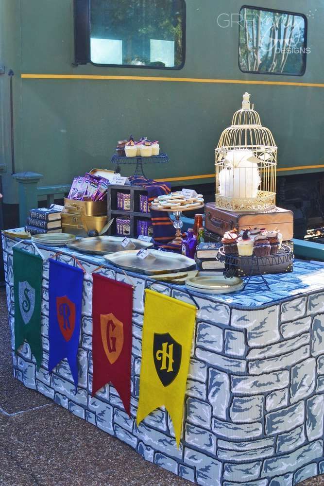 a table that has some food on top of it and flags hanging from the side