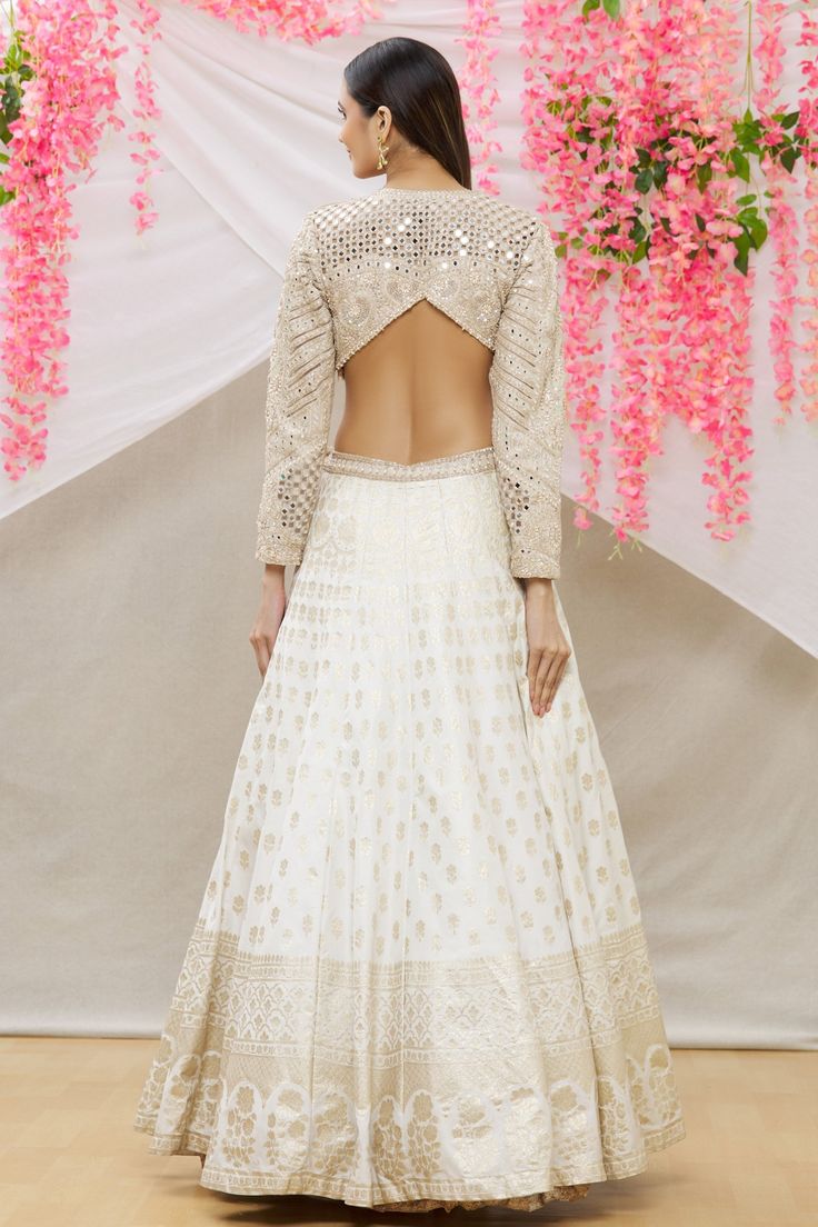 Ivory gown with zardozi, floral, mirror work and side cut-out detailing.
Component: 1
Pattern: Embroidery
Type Of Work: Zardozi, floral, mirror
Neckline: Round
Sleeve Type: Full sleeves
Fabric: Banarasi silk
Color: White
Other Details: 
Back and side cut-out
Occasion: Reception - Aza Fashions Neha Mehta, Embroidery Zardozi, Floral Mirror, Ivory Gown, Couture Gown, Gown For Women, Pattern Embroidery, Gowns Online, Silk Embroidery