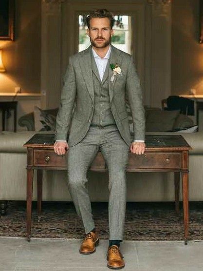 a man in a suit sitting on a table