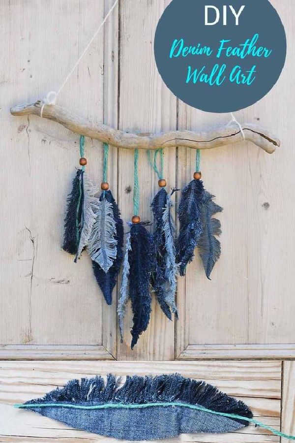 there are feathers hanging on the wall as if they were made out of driftwood