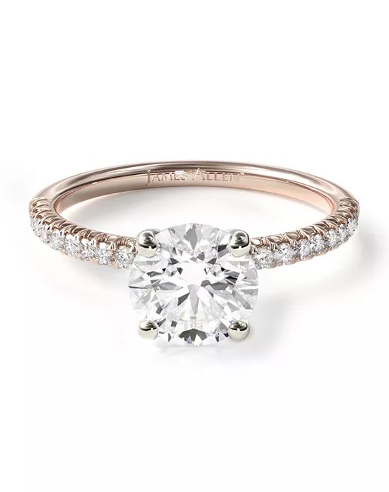 a diamond engagement ring with two rows of diamonds on the band and a round center stone