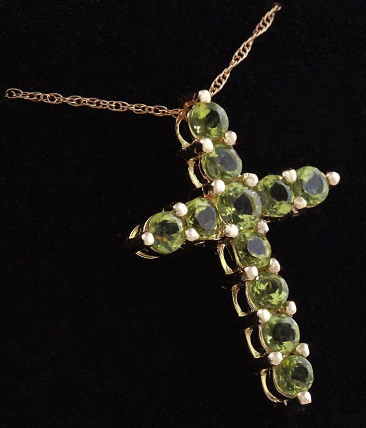 1.20 Carat Natural Green Peridot 14K Solid Yellow Gold Cross Pendant with Chain Amazing looking piece! Suggested Replacement Value: Approx. $1600.00 Total Natural Round Cut Green Peridots Weight: 1.20 Carat Chain Length is: 16 inches Pendant measures: Approx. 25 x 18.4mm Total item weight is: Approx. 2.1g Disclaimer: all weights, measurements and colors are approximate and may vary slightly from the listed dimensions or as seen in the image. All pictures are magnified to show the smallest of det Luxury Yellow Gold Peridot Jewelry, Fine Jewelry Peridot Gemstones For Formal Occasions, Luxury Peridot Jewelry For Formal Occasions, Luxury Gold Jewelry With Peridot, Luxury Gold Peridot Jewelry, Formal Yellow Gold Peridot Necklace, Formal Yellow Gold Peridot Necklaces, Luxury Peridot Jewelry For Gifts, Luxury Peridot Multi-stone Jewelry