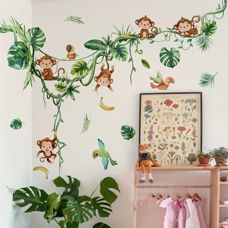 the wall is decorated with monkeys and tropical leaves in this kids's nursery room