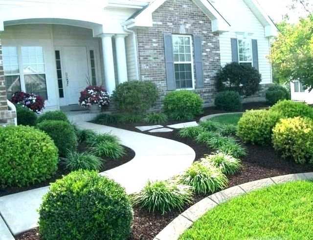 a house with landscaping in front of it