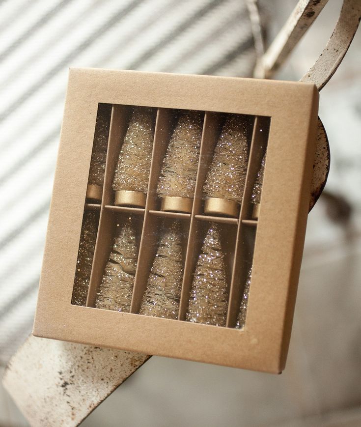 an open cardboard box with christmas trees in it