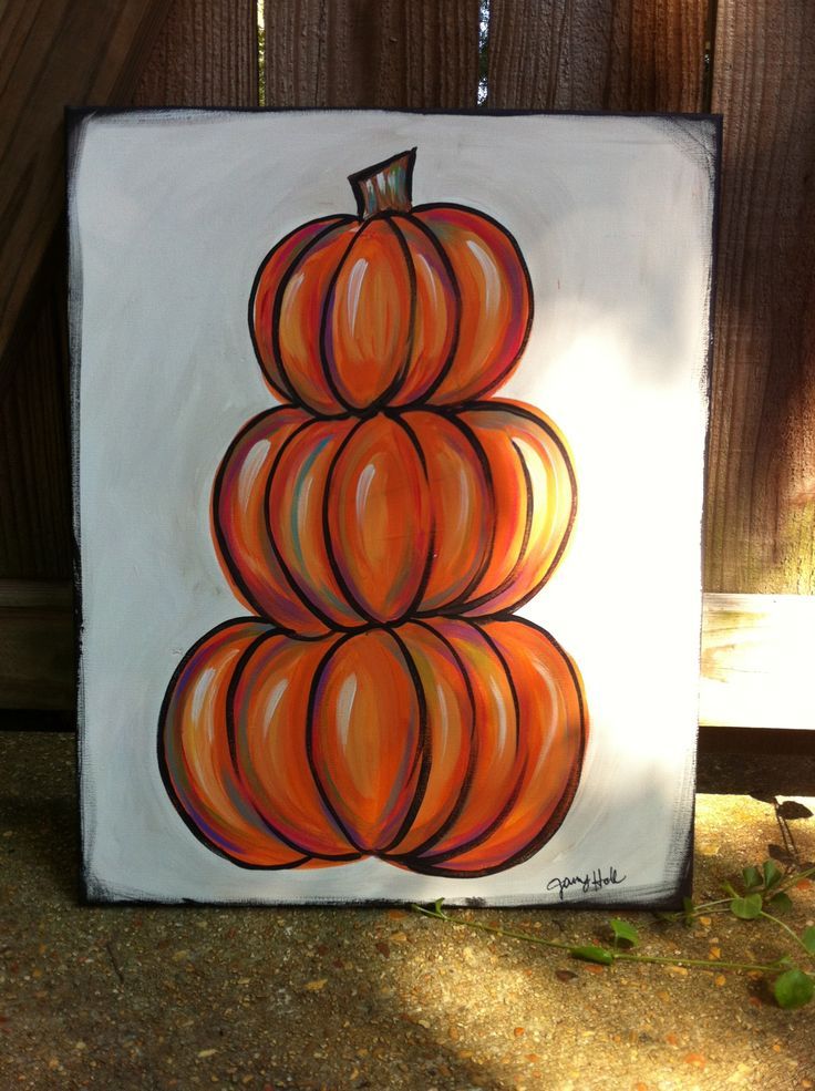 an orange pumpkin painted on a white canvas