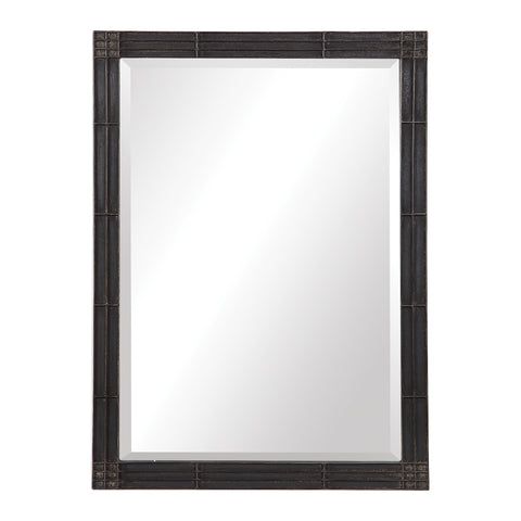 a mirror that is sitting on top of a wall next to a white wall and a black frame