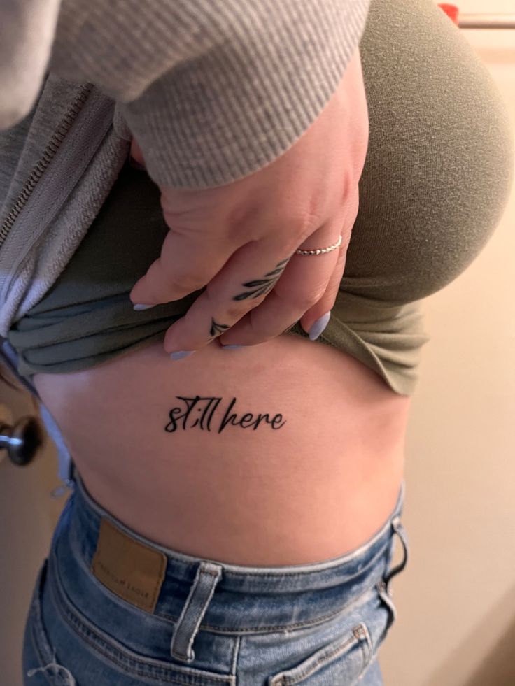 a woman's stomach with the word, there written on it