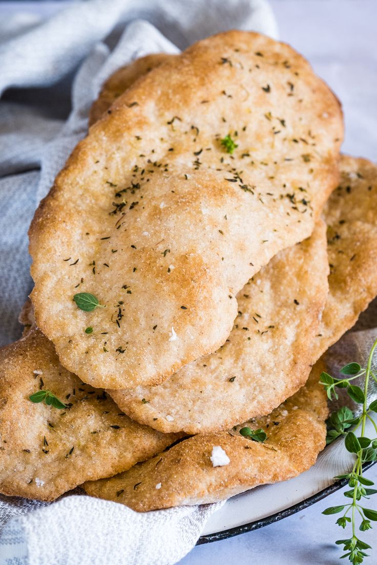 three crackers stacked on top of each other next to a sprig of parsley