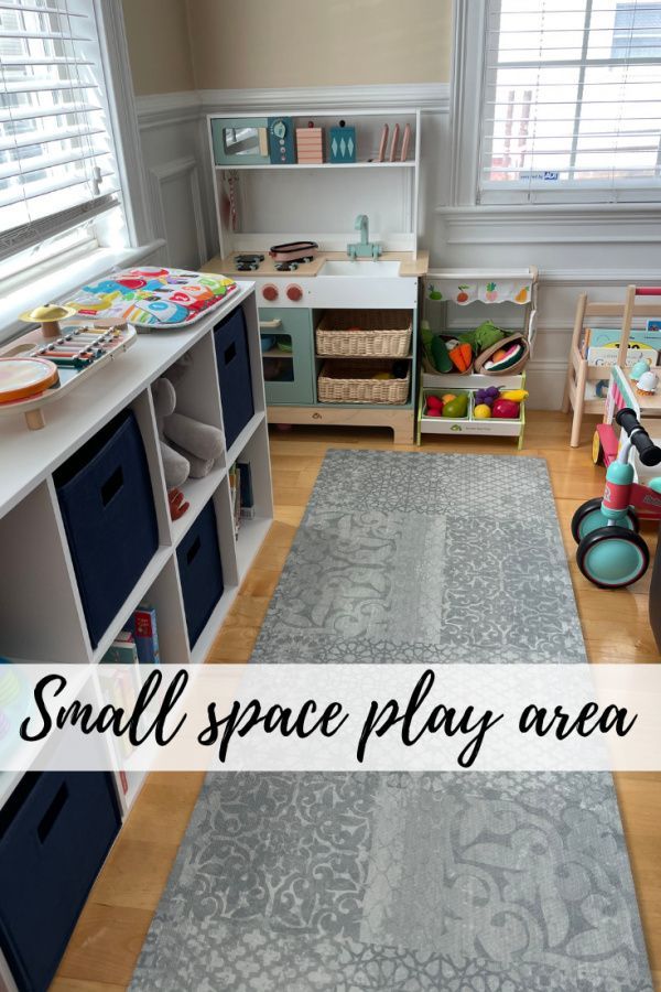 small space play area with toy bins and toys