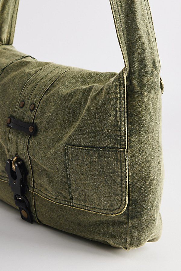 Classic look messenger bag with a flap top closure. Washed cotton bag with a secure latch closure front and rivet accents at the shoulder strap. Features Patched messenger bag Washed cotton bag Flap front Secure buckle down closure Shoulder strap Content + Care 100% Cotton Spot clean Imported | Patched Messenger Bag in Olive, Men's at Urban Outfitters Canvas Satchel Shoulder Bag With Snap Closure, Casual Flap Bag With Adjustable Strap, Everyday Flap Shoulder Bag With Snap Closure, Everyday Canvas Satchel With Snap Closure, Vintage Cotton Canvas Bag With Adjustable Strap, Canvas Satchel Bag With Snap Closure, Rectangular Canvas Shoulder Bag With Snap Closure, Outdoor Canvas Shoulder Bag With Flap, Canvas Crossbody Shoulder Bag With Snap Closure