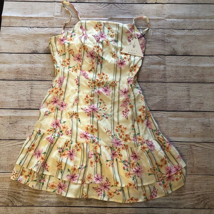 Bloom Baby Mini Dress New With Tags Yellow Floral Print Flower Dress Casual Short, Spring Lemon Print Sundress For Vacation, Yellow Mini Dress For Spring Vacation, Yellow Ruffled Sundress For Summer, Casual Lemon Print Sundress For Beach, Yellow Casual Sundress With Ruffles, Cute Yellow Dress For Garden Party, Casual Yellow Ruffled Sundress, Casual Yellow Sundress With Ruffles