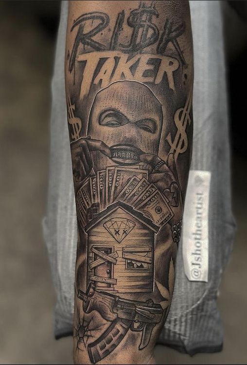 a man with a tattoo on his arm that says rider taker and has money coming out of it