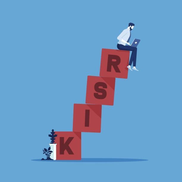 a man sitting on top of a red block with the word risky written across it