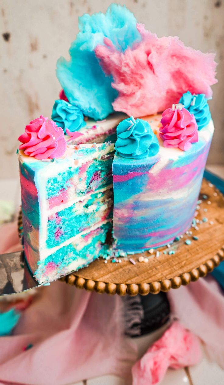 a colorful cake with two pieces cut out