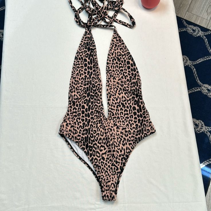 Size L Swimsuit Never Worn Summer Party One Piece With Prints, Summer Party Bodysuit With Print, Summer Party Printed Bodysuit, Printed Bodysuit For Beach Season Parties, Summer Party Bodysuit With Printed Details, Amazon Stretch Swimwear For Summer, Leopard Print Fitted Swimwear For Spring, Amazon Stretch Swimwear For The Beach, Leopard Print Bodysuit For Swimming In Summer