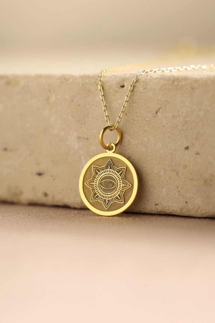 Gold  Evil Eye Pendant -  Evil Eye Gold Necklace ● Material of pendant: Solid Gold 14k ( REAL GOLD ) ● Metal Stamp: 14k ( REAL GOLD ) ● The pendant is available in 5 sizes: - 12,7 mm / 0.5 inches (Diameter) - 14,0 mm / 0,55 inches ( Diameter ) In the photos - 15,3 mm / 0.6 inches ( Diameter ) - 16,5 mm / 0,65 inches ( Diameter ) - 19,1 mm / 0,75 inches ( Diameter ) ( In the photos the size is 14mm / 0.55 inches Diameter ) ( Jump Ring inner diameter: 4 mm ) ● Material of chain: Solid gold 14k ( R Symbolic Gold-plated Coin Necklace, Gold-tone Amulet Necklace With Round Pendant, 14k Gold Medallion Necklace Amulet Style As A Gift, Gold Plated Round Amulet Charm Necklace, 14k Gold Amulet Medallion Necklace As A Gift, Symbolic Yellow Gold Plated Medallion Necklace, Symbolic Engraved Yellow Gold Medallion Necklace, Nickel-free Gold Plated Spiritual Necklaces, Yellow Gold Medallion Charm Necklace Amulet Style