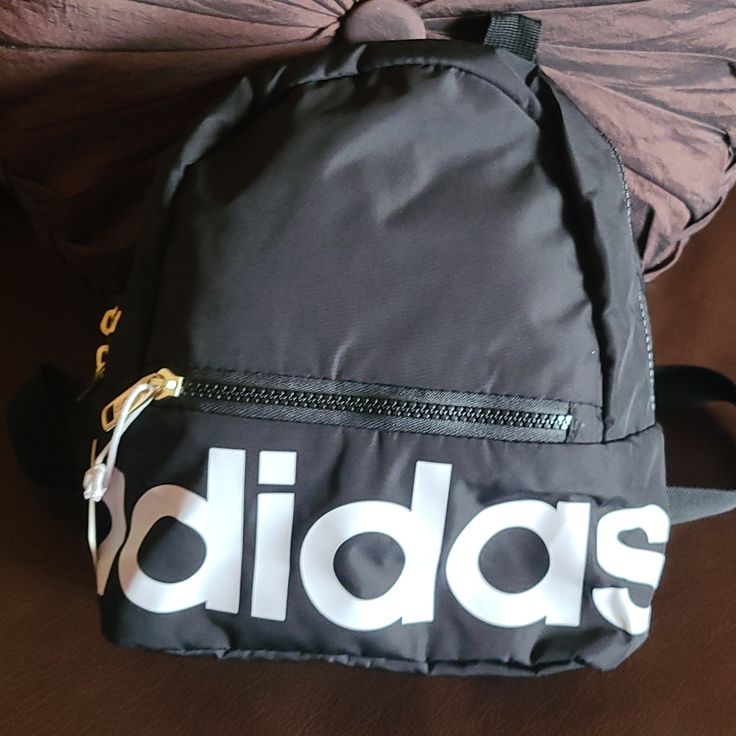 100%Polyester Trendy Adidas Shoulder Bag For Daily Use, White Adidas Sporty Backpack, Adidas Sporty White Backpack, Adidas White Sporty Backpack, Trendy White Adidas Bag, Adidas Bag With Zipper For Everyday Use, Adidas Bag With Zipper Closure For Everyday Use, Trendy Adidas Backpack For Back To School, Trendy Adidas Backpack For Everyday Use