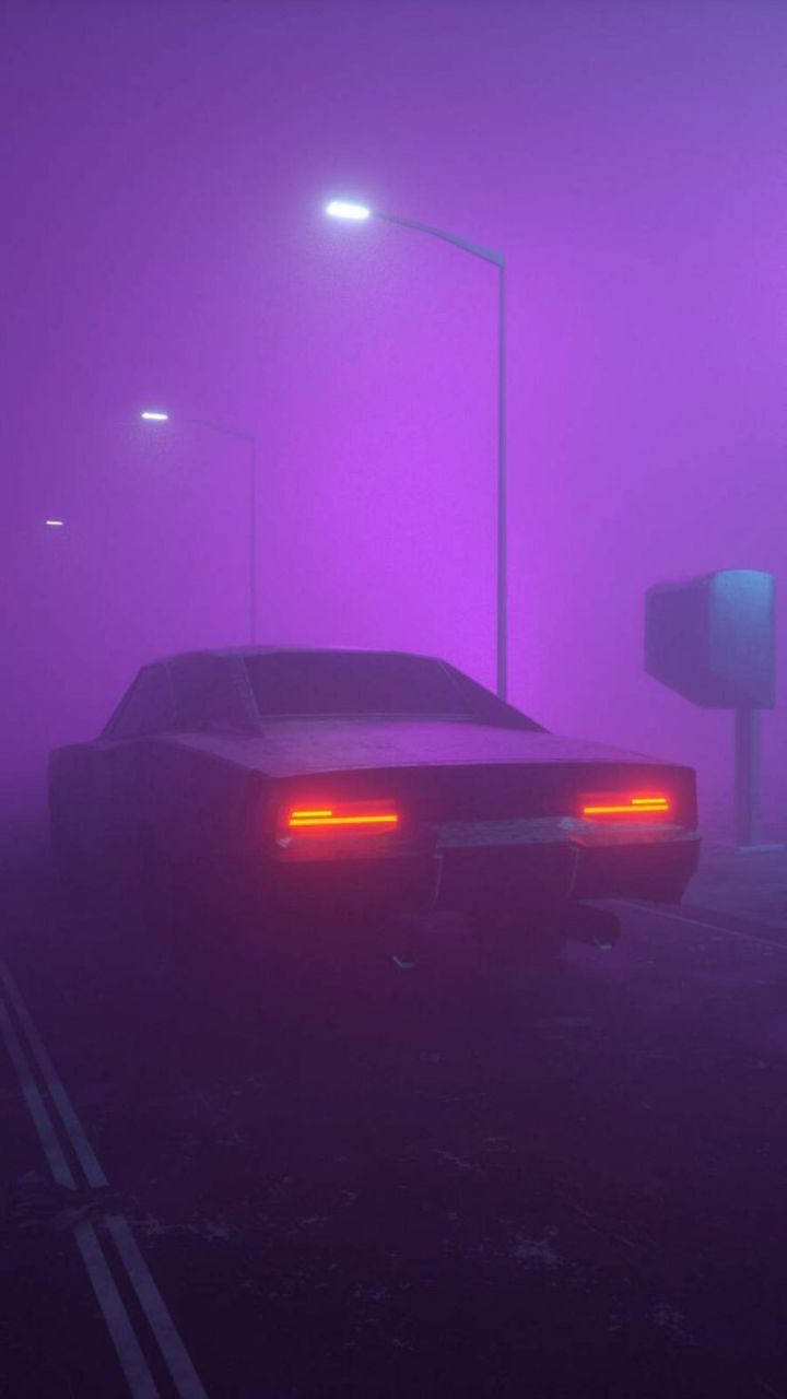 two cars are parked in the fog at night