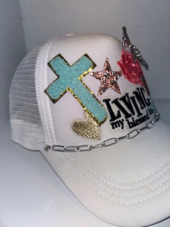 Faith themed Trucker Patch Hat. These are the hottest trend on social media today. Great for festivals, concerts, night life and everyday wear. This foam trucker hat is fully adjustable and offered in hat colors Black, White, Light Pink, Neon Pink, Neon Yellow and Green Camouflage. Custom Hats avail. One size fits all. $45 Small Print: patch, mama, cowboy, hat, faith, rock and Roll, trucker, patch, cap, chain, iron on, sew on, festival, concert, neon, baseball cap, ball hat, chain, vintage, retro, trendy, patch hat, cowgirl, rocker mama, mom, beanie, rodeo, applique designs, embroidered, polyester hat, gifts for her, night life, everyday hat, collage cap, sparkly, sparkle hat, horse, charms Adjustable Trucker Hat For Festivals, Trendy Festival Trucker Hat With Flat Brim, Festival Trucker Hat Snapback, One Size, Festival Trucker Snapback Baseball Cap, Adjustable Trucker Baseball Cap For Festival, Festival Trucker Snapback Hat, Trucker Snapback Hat For Festivals, One Size Fits Most Snapback Trucker Hat For Festivals, Festival Snapback Trucker Hat