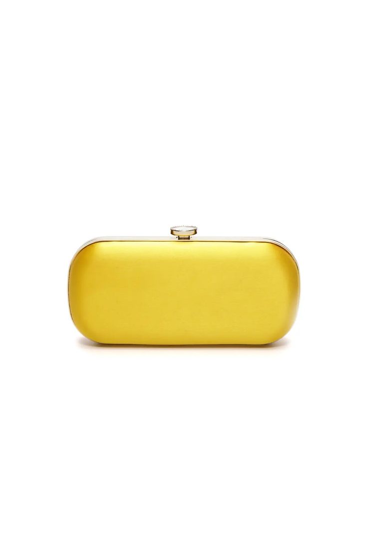 The Limoncello Yellow Bella Clutch is a bold yellow bridal handbag, crafted with duchess satin by Italian artisans featuring a lively pop of color. Planning a maximalist wedding day or looking to make a powerful statement at your next gala? Inspired by Italy’s Amalfi Coast, a coastline featuring terraced vineyards and cliffside lemon groves, this luxury handbag will make a statement on your wedding day, at a red-carpet affair, or on a tropical destination trip. First seen on celebrity stylist Micaela Erlanger during her Miami wedding weekend, the Limoncello Yellow Bella Clutch is a refreshing, chic, and colorful bridal clutch. The Bella Clutch was inspired by a vintage oval-shaped sapphire ring that founder, Maria Caruso-Martin commissioned as a nod to the honorable Princess Diana. The com Maximalist Wedding, Bridal Handbag, Red Carpet Affair, Celebrity Stylist, Frame Fabric, Bridal Handbags, Yellow Satin, Duchess Satin, Tropical Destinations