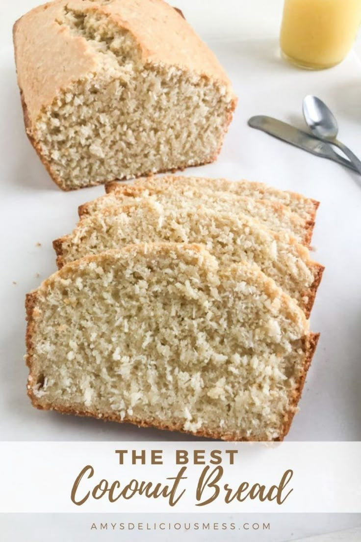 two slices of coconut bread on a white plate next to a glass of orange juice