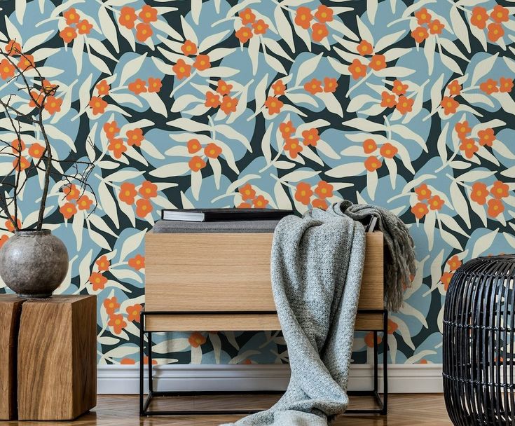 Blossoms Flowing Leaves Stones - Orange Blue HappyWall Wallpaper  Small Coral Orange Flowers Growing on White Flowing Palm / Tropical Style Leaves with a Light Denim Blue and Dark Slate Background Resembling River Stones. Floral Wallpaper Ideas, Orange Blue Wallpaper, Wallpaper Light Blue, Colorful Table Setting, Wallpaper Light, Colorful Room Decor, Cool Kids Rooms, Maximalist Design, Bold Wallpaper