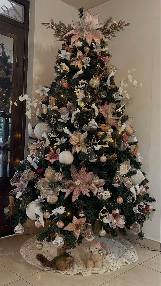 a decorated christmas tree in the corner of a room