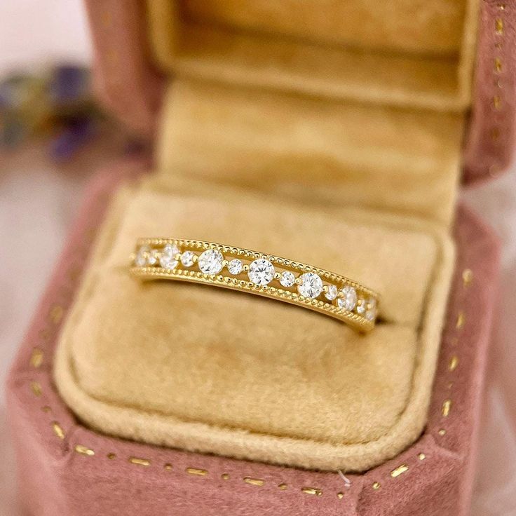 Crafted entirely from 14K solid gold, this dainty stackable ring adds a touch of elegance to any ensemble.  ♡ Features  * Gold Kt: 14K Solid Gold * Available Gold Color: Yellow Gold * Ring Size: 3 1/2 - 8 1/2 US/CA * Gemstone: Cubic Zirconia, can be customized with Moissanite * Stone Color: Flawless D Color * Stone Cut: Round Cut * Band Width: 2.6mm * Stamped with 14K (AU585) hallmark  ♡ Shipping & Returns Orders placed Monday - Friday will ship within 3-7 business days. Please contact us if you Elegant Gold Stackable Rings With Decorative Band, Elegant Gold Stackable Diamond Ring, Classic Stackable Rings With Decorative Band For Promise, Delicate Gold Stackable Rings With Prong Setting, Heirloom Stackable Diamond Ring For Anniversary, Elegant Diamond Ring With Decorative Band Gift, Delicate Diamond Cut Stackable Rings For Anniversary, Delicate Gold Stackable Rings With Brilliant Cut, Delicate Yellow Gold Half Eternity Ring