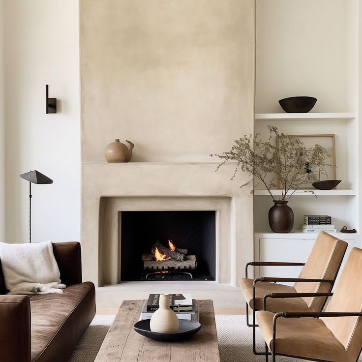 a living room filled with furniture and a fire place