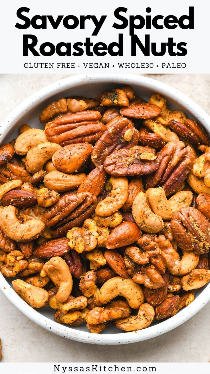 a white bowl filled with roasted nuts and text saying savory spiced roasted nuts