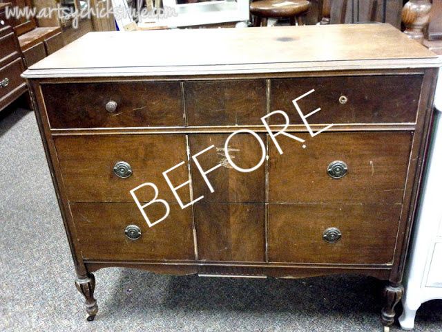 an old wooden dresser sitting on the floor