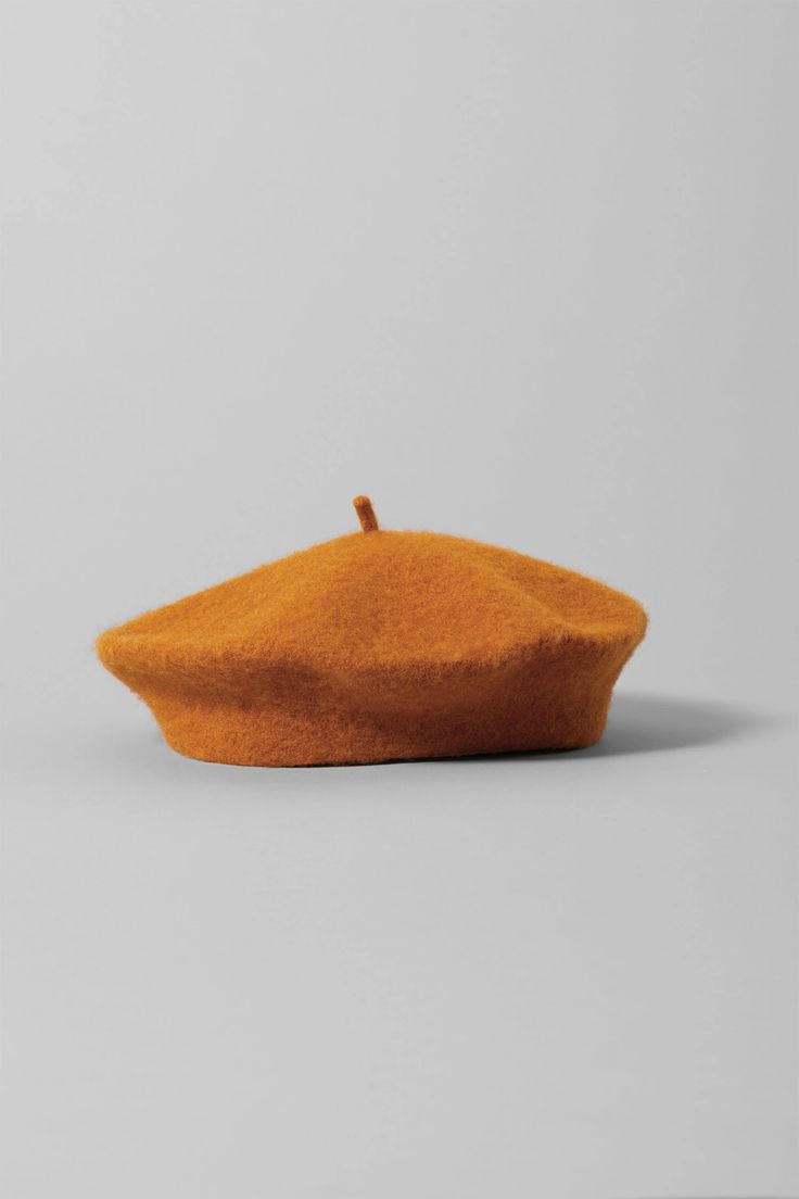 an orange hat sitting on top of a table