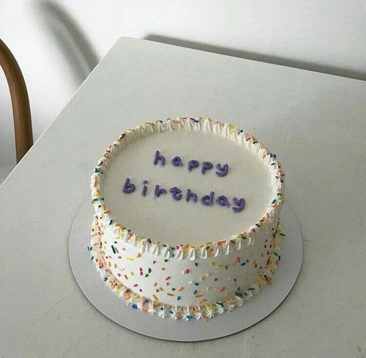 a birthday cake with the words happy birthday written in frosting and sprinkles