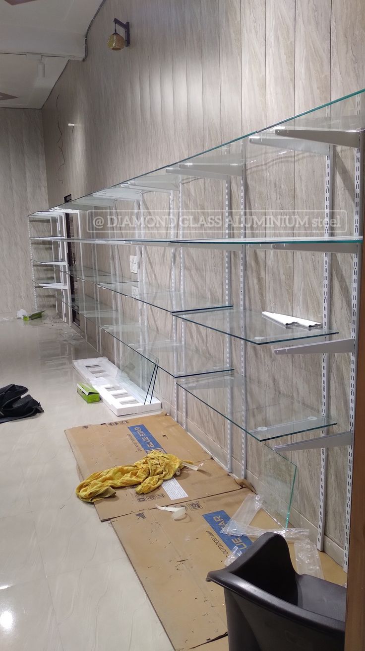 Glass shelf rock for 8mm glass full info Glass Self Design Wall, Glass Racks Shelves For Shop, Store Racks Display, Racks Design Display For Shop, Glass Racks Shelves, Racks Design Display, Display Rack Design Retail Stores, Shop Rack Design, Display Design Shop