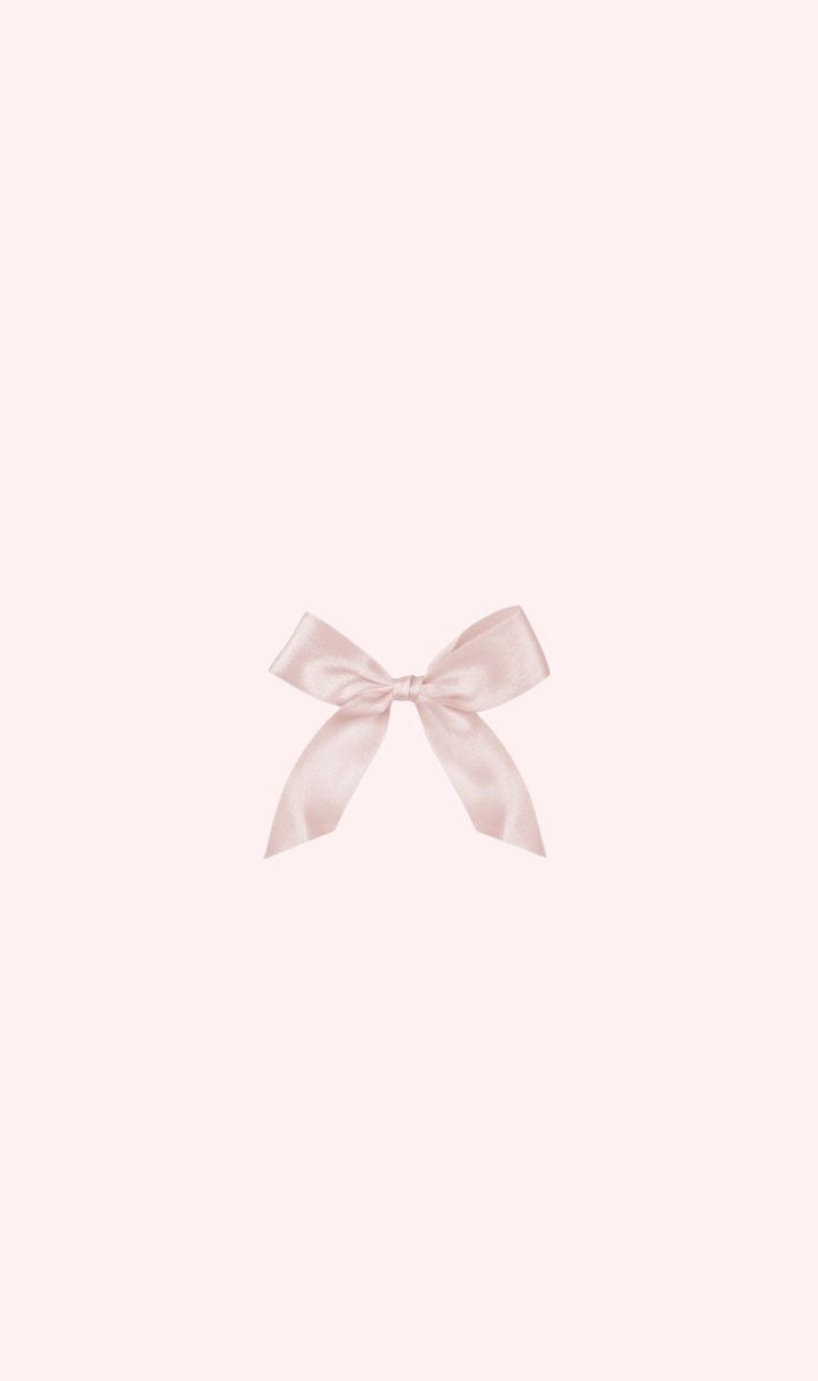 a white bow on a pink background