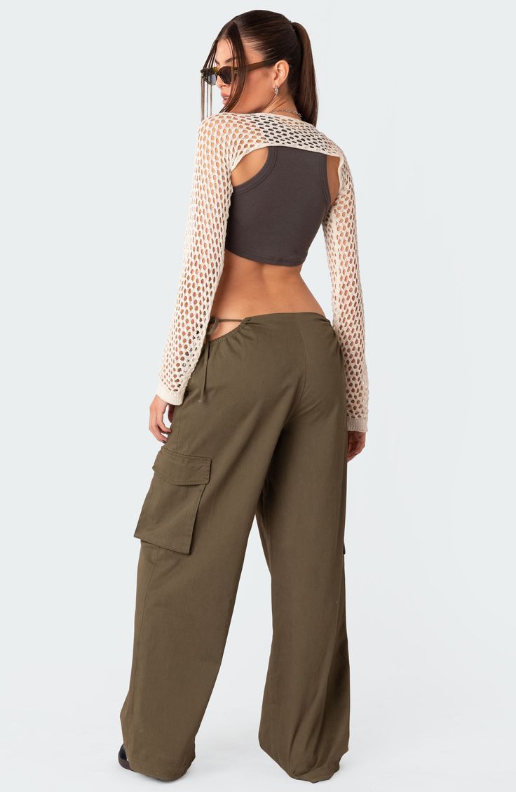 Stand out in streetwear-inspired style with these roomy cargo pants featuring flirty side cutouts, handy pockets and a low rise for a 2000s-inspired look. 100% cotton Machine wash, dry flat Imported Cargo Pants Low Rise, Pants Low Rise, Side Pants, Swimwear Dress, Side Cuts, Military Style, Military Fashion, Model Height, Cut Outs