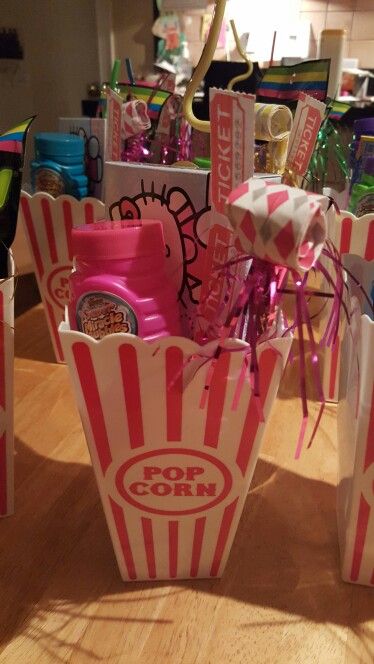 some pink and white striped bags on a table