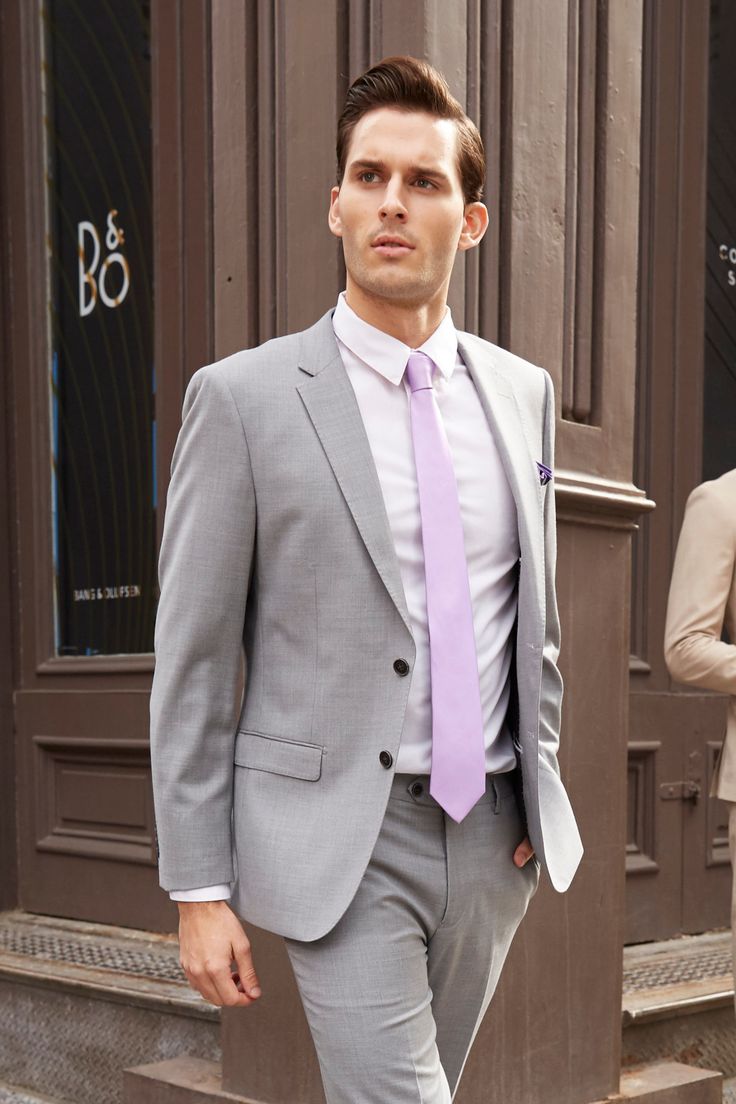 The Lite Grey Jacket is perfect for any wedding, special occasion or business setting. We tirelessly evaluate thousands of fabrics before choosing the best in the industry. Our attention to detail is evident in luxury features like pick-stitching on the lapel and kissing buttons. We use the finest, most breathable, natural, 100% super fine 150’s Merino wool making the suit soft to the touch while remaining breathable and extremely comfortable for everyday use. The gorgeous lining brings together Spring Wedding Slim Fit Blazer, Spring Formal Suit With Notch Lapel, Single Breasted Suits For Spring Formal, Formal Slim Fit Blazer For Spring, Elegant Slim Fit Blazer For Spring, Slim Fit Formal Blazer For Spring, Elegant Slim Fit Spring Blazer, Spring Wedding Suits With Suit Collar, Fitted Single Button Outerwear For Wedding