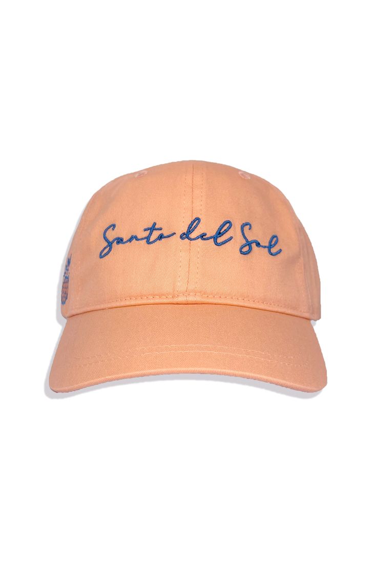 The perfect sun worshiper hat in a take everywhere, unstructured style. Santo del sol (Saint of the Sun) is part of our latest Santa Cruz print. Adjustable back metal slide. 100% Cotton OS Casual Beach Hat With Embroidered Logo, Casual Orange Hat With Embroidered Logo, Western-themed Flat Brim Sun Hat, Yellow Embroidered Snapback Hat, Visor Hat With Embroidered Logo, One Size, Metal Slide, Sun