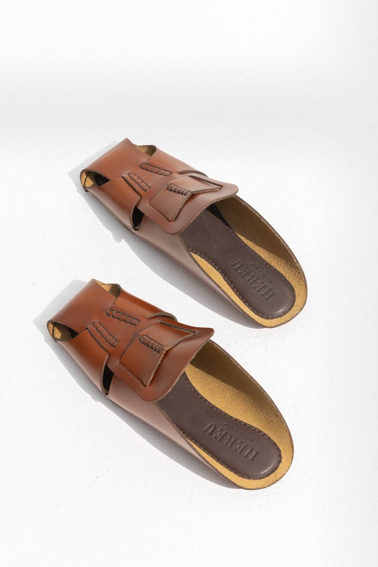 HEREU MUNTANA FLAT MULE - TAN Brown Calf Leather Slip-on Mules, Brown Leather Sandals For Fall, Designer Mules With Leather Footbed For Work, Designer Mules For Workwear With Leather Footbed, Designer Workwear Mules With Leather Footbed, Designer Brown Mules With Leather Lining, Designer Calf Leather Slip-on Mules, Leather Sole Slip-on Mules For Galas, Brown Leather Sole Sandals For Work