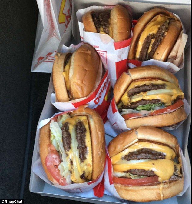 six cheeseburgers are sitting in a box