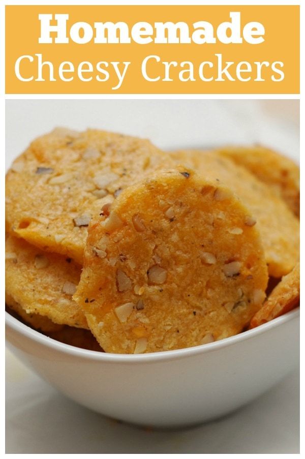 homemade cheesy crackers in a white bowl with the title overlay reading homemade cheesy crackers