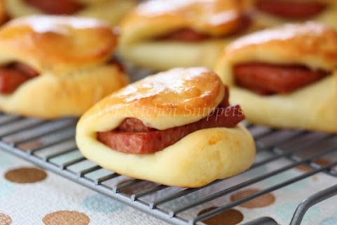 some hot dogs are sitting on a cooling rack