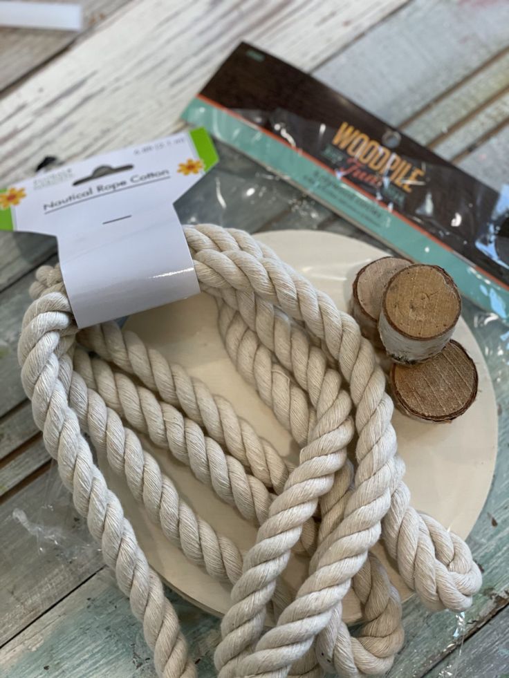 there is a rope on the plate and two pieces of wood in front of it