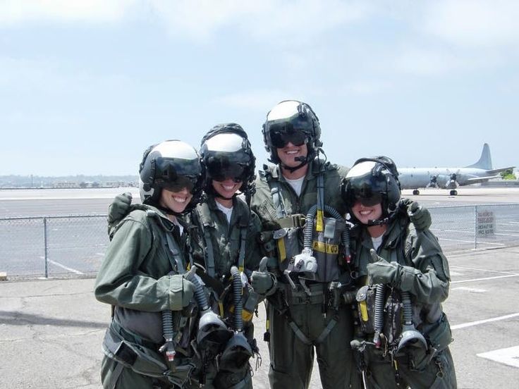 four people in fighter gear posing for a photo