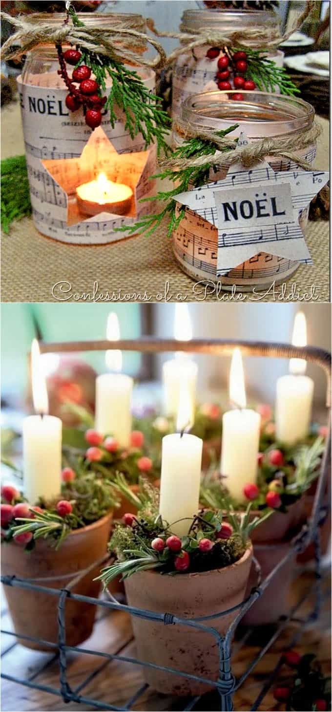 some candles are sitting in small pots with holly and pine cones on the rims