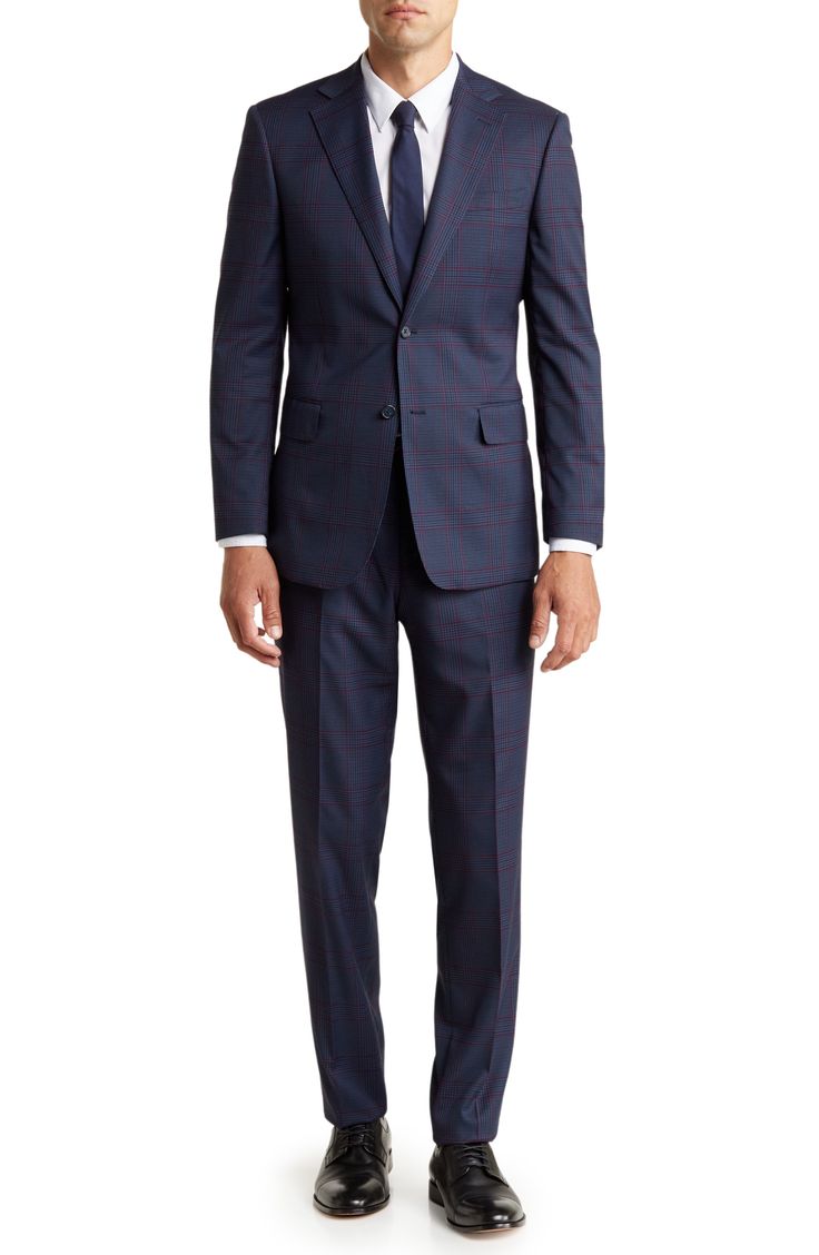 Make a dapper appearance at your next formal event in this clean-cut plaid suit that includes a peak lapel jacket and flat-front trousers. Jacket: 30.5" length (size 40R); trousers: 11" rise, 36" inseam (size 33W) Jacket has four-button cuffs; chest welt pocket; front flap pockets
 Trousers have zip fly closure; front pockets; back pockets
 Trousers have zip fly closure; front pockets; back pockets Shell: 82% polyester, 15% rayon, 3% spandex Lining: 100% polyester Dry clean Imported Model stats: Tailored Plaid Suit With Notch Lapel, Plaid Suits With Welt Pockets For Business, Classic Plaid Three-piece Business Suit, Dapper Business Suit With Notch Lapel, Plaid Three-piece Suit With Notch Lapel For Formal Occasions, Plaid Suits For Semi-formal Occasions, Plaid Semi-formal Suit, Semi-formal Plaid Suit, Plaid Notch Lapel Suit For Business Casual