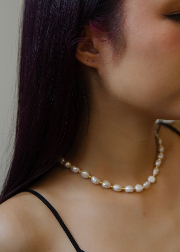 This classic necklace, with its lustrous pearls, has the power to elevate even the simplest white tank top into a sophisticated ensemble. Its versatility is unmatched, effortlessly transitioning from casual daywear to elegant evening attire. Natural Baroque Pearls + 18K Gold Plated on Sterling Silver. Length: 16 inches + 2 inches extender. Pearl size: 10-12mm. Chic White Pearl Necklace For Everyday, Chic Everyday White Pearl Necklace, Classic Necklace, Silver Shop, Pearl Size, Evening Attire, White Tank Top, Baroque Pearls, White Tank